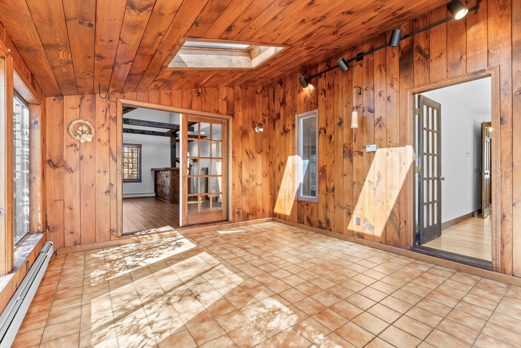 210 King Phillips Pathe Marshfield, MA 02050 - Photo 18 of 42 a view of a room with wooden walls and stairs