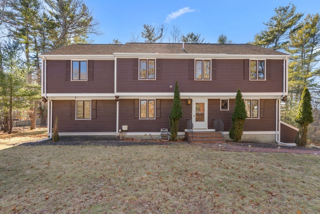 210 King Phillips Pathe Marshfield, MA 02050 - Photo 2 of 42 a front view of a house with a yard
