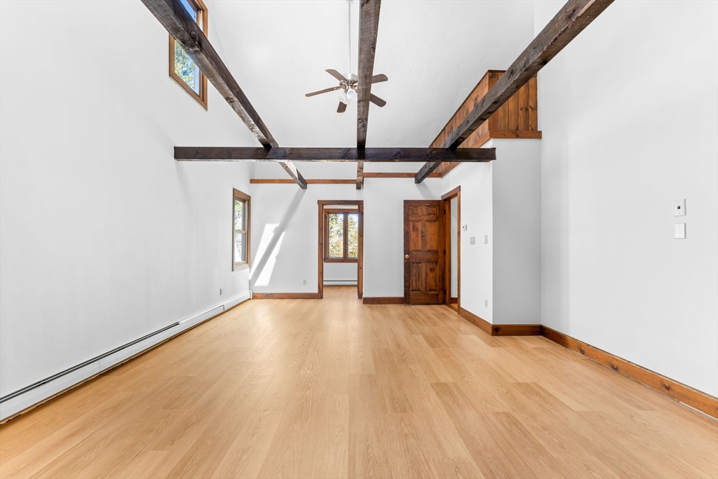210 King Phillips Pathe Marshfield, MA 02050 - Photo 25 of 42 a view of a hallway with wooden floor and staircase