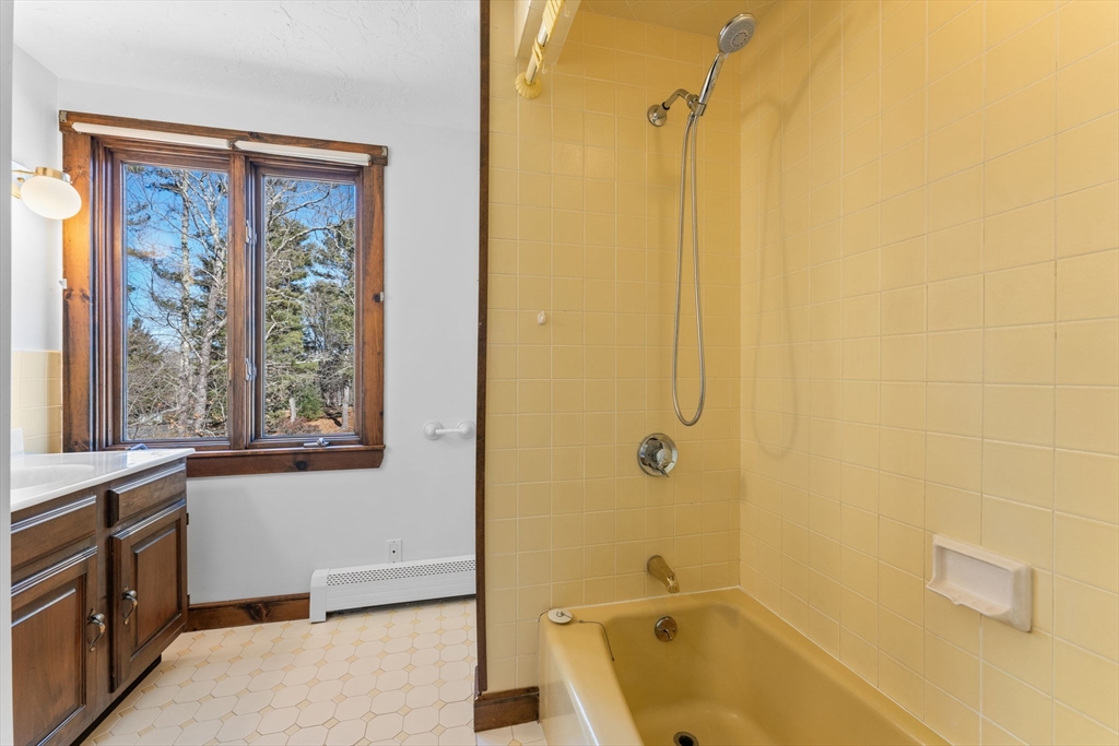 210 King Phillips Pathe Marshfield, MA 02050 - Photo 31 of 42 a bathroom with a tub a sink a window and a shower