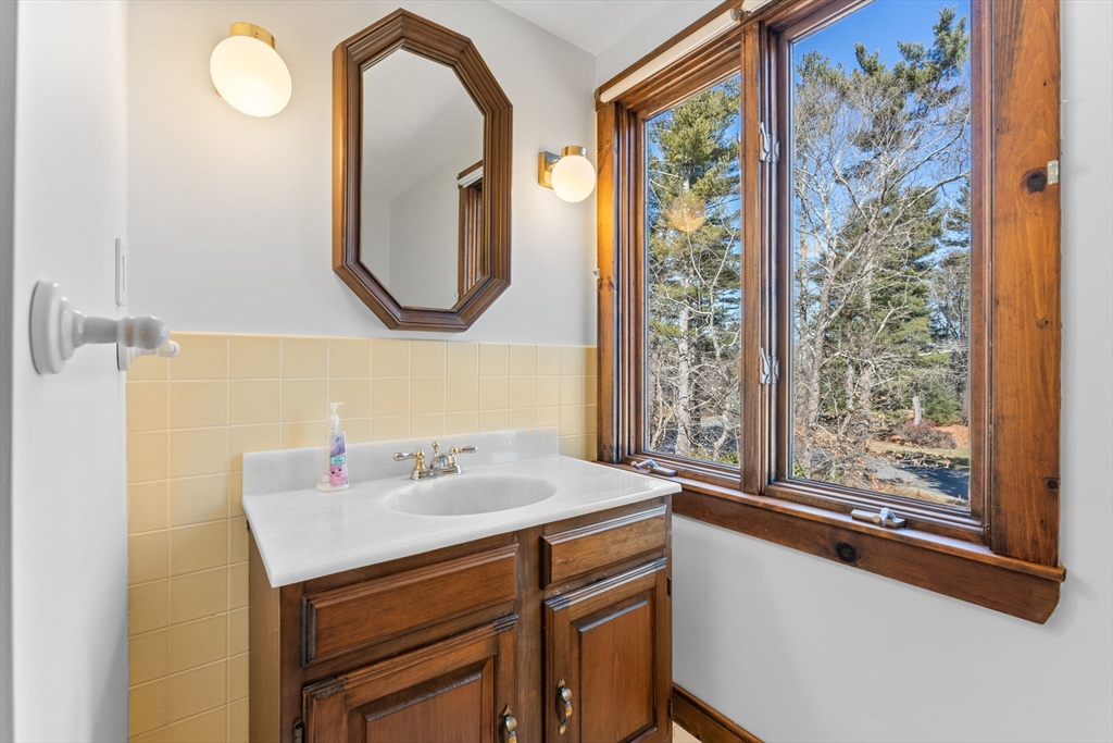 210 King Phillips Pathe Marshfield, MA 02050 - Photo 32 of 42 a bathroom with a sink and a mirror