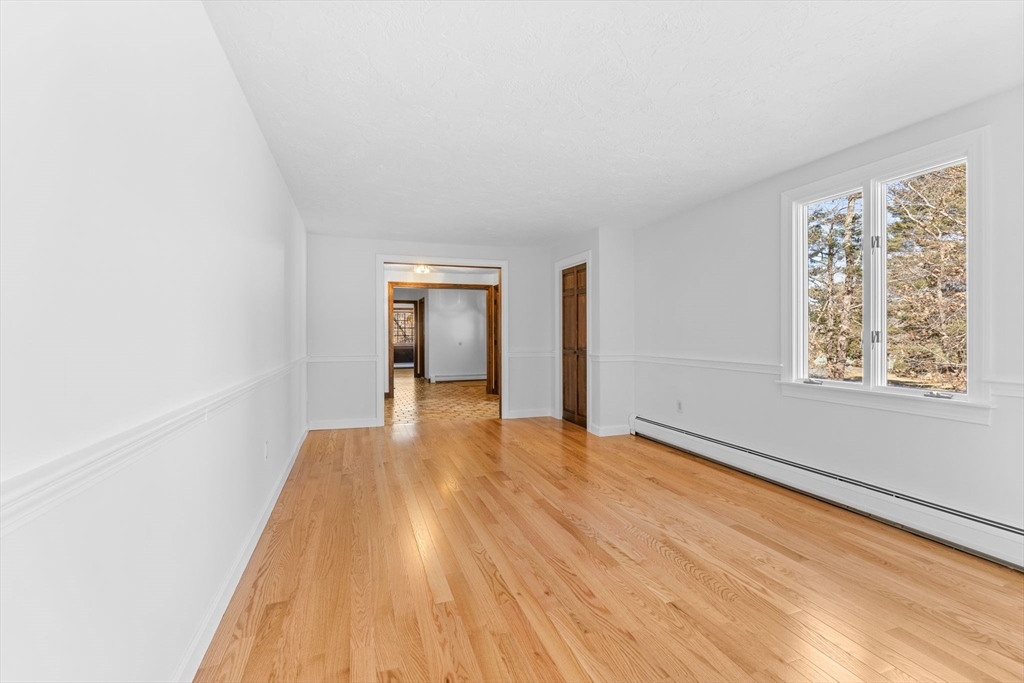 210 King Phillips Pathe Marshfield, MA 02050 - Photo 5 of 42 a view of an empty room and window