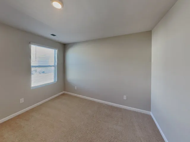 a bathroom with a toilet and a bathtub