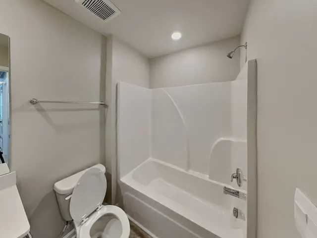 a bathroom with a sink a toilet and a bathtub