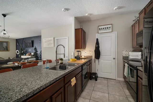 a kitchen with sink and lots of counter space