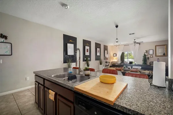 a kitchen with sink and cabinets