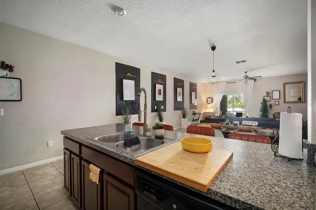 a kitchen with sink and cabinets
