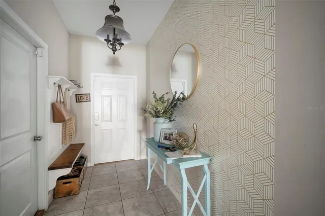 a view of a livingroom with furniture and a chandelier