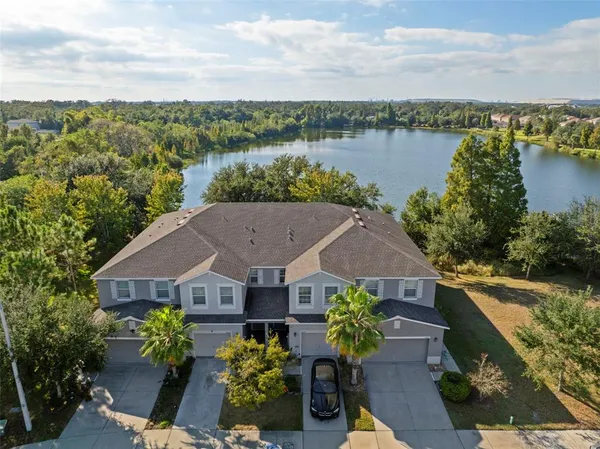 a aerial view of a house with a yard and a garden