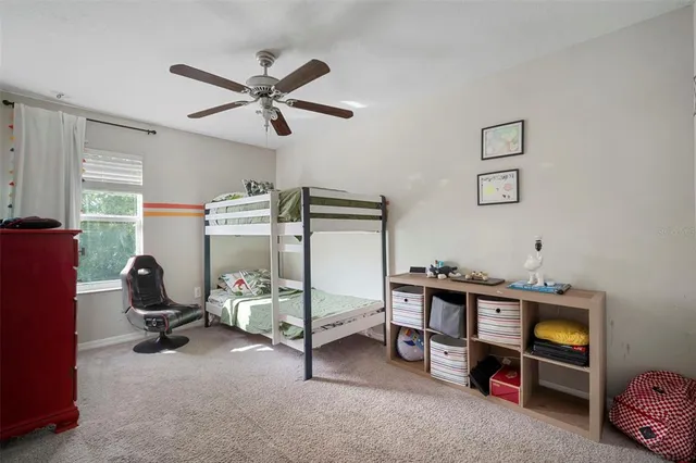 a view of a livingroom with workspace and a window