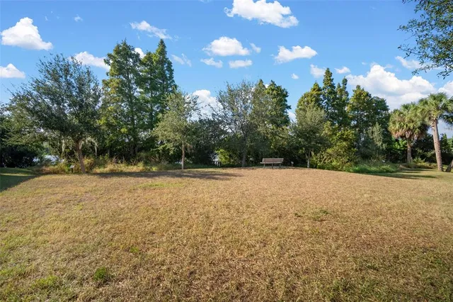 a backyard of a house with lots of green space