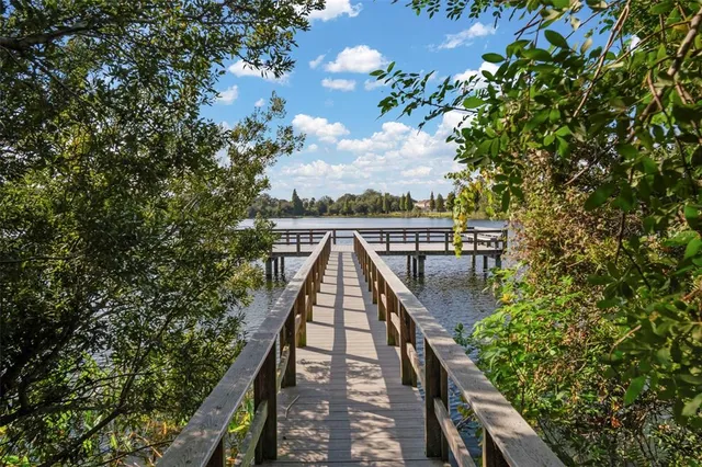 a view of swimming pool with a lake