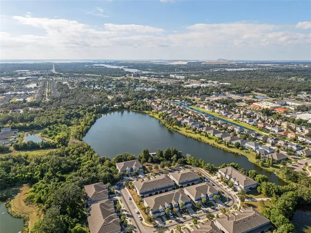 an aerial view of residential houses with outdoor space