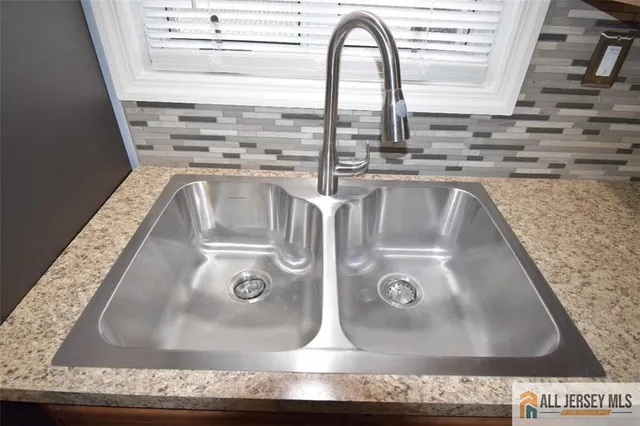 a stove top oven sitting inside of a kitchen