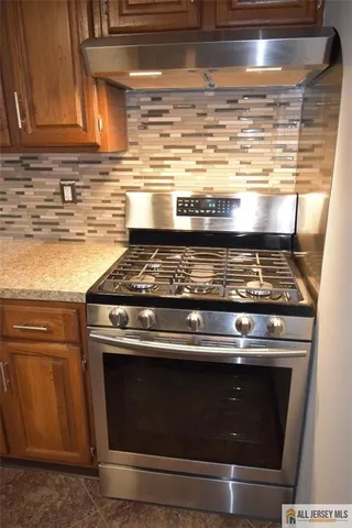 a view of a refrigerator in a kitchen