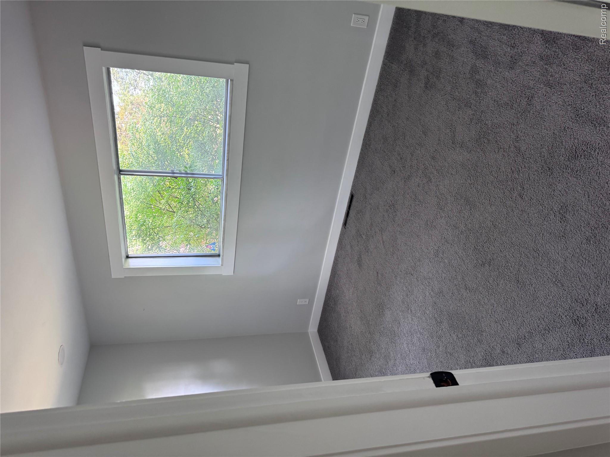 2330 Walton Blvd. Rochester, MI 48309 - Photo 12 of 12 Light gray wall finishes and dark gray carpeting