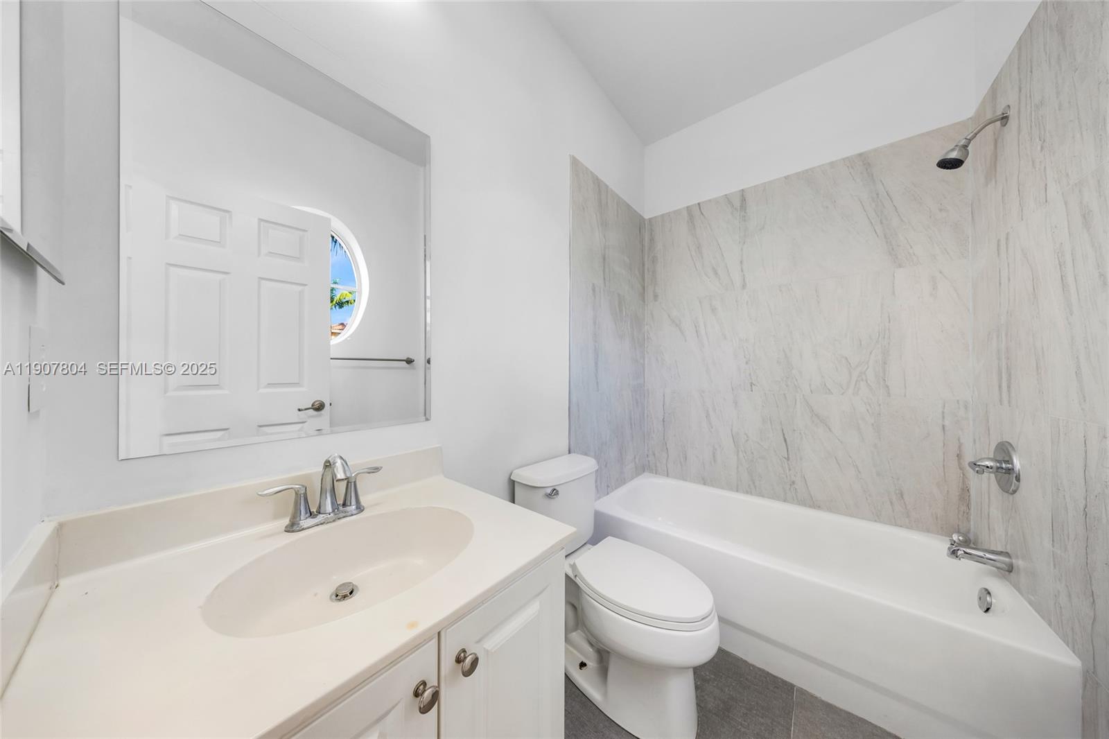 12040 Southwest 28th Street, Unit 4064 Miramar, FL 33025 - Photo 14 of 19 a bathroom with a sink toilet and shower