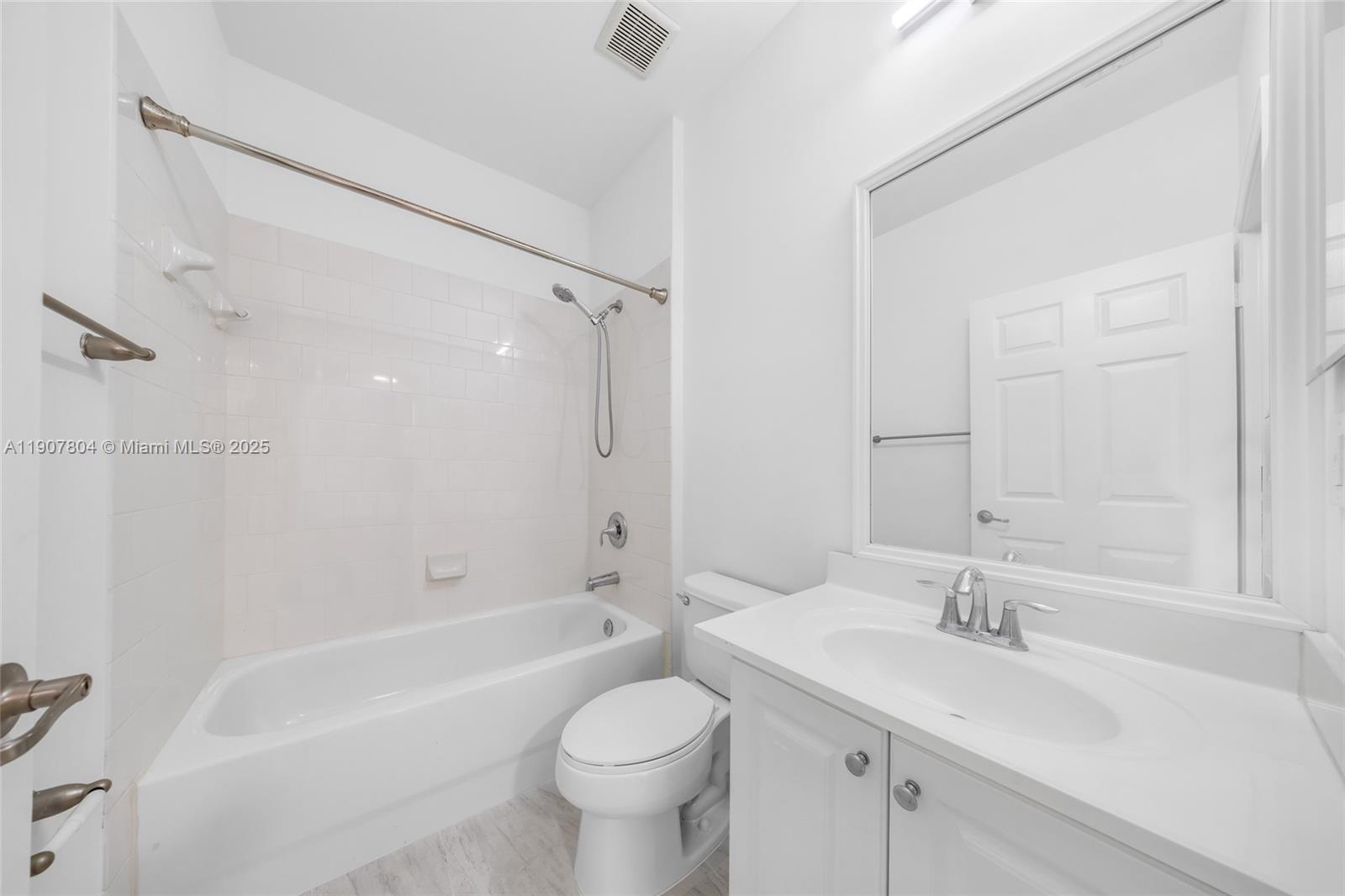 12040 Southwest 28th Street, Unit 4064 Miramar, FL 33025 - Photo 16 of 19 a bathroom with a sink toilet vanity and shower