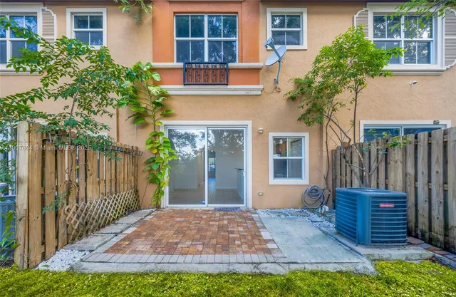 a view of a backyard with a large tree