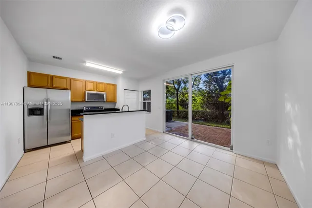 a view of a kitchen with a sink and microwave