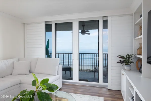 a bedroom with a bed and a night stand