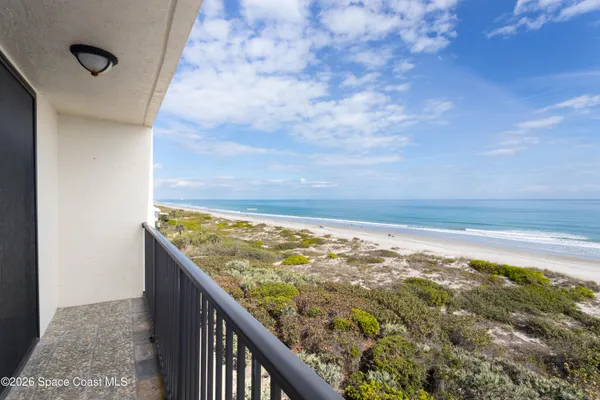 a swimming pool with outdoor seating and yard