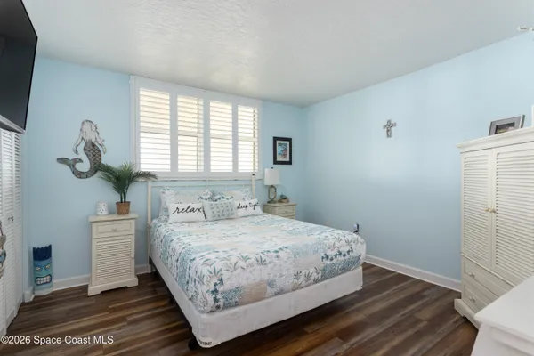 a view of a dining room with furniture and a large window