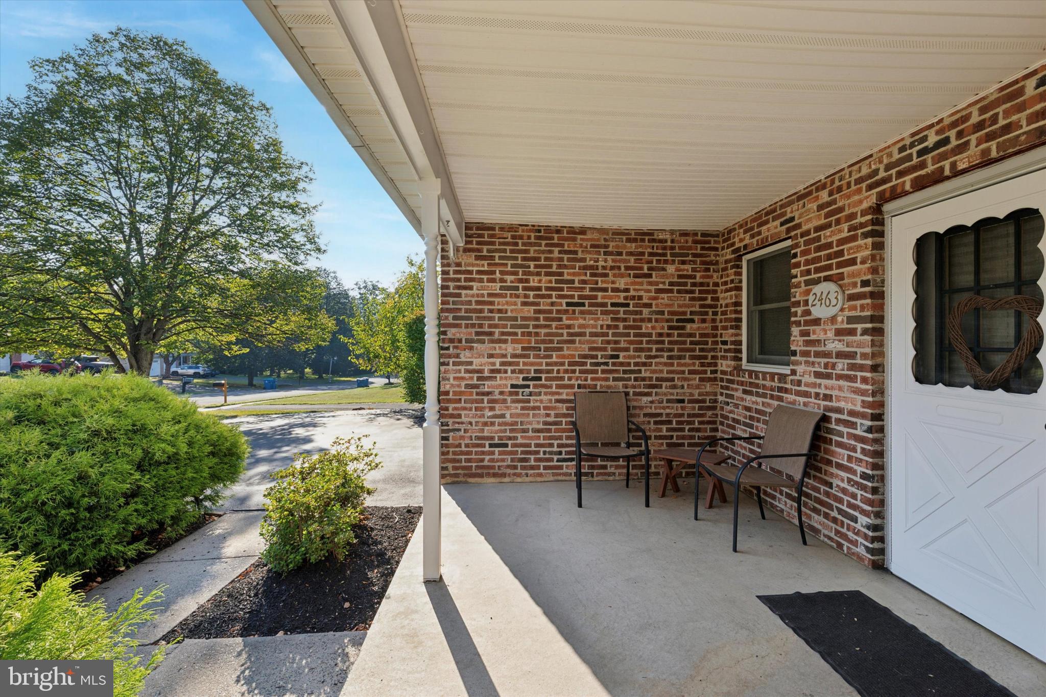 2463 Pine Cone Road Warrington, PA 18976 - Photo 40 of 44 a view of a patio with table and chairs and potted plants