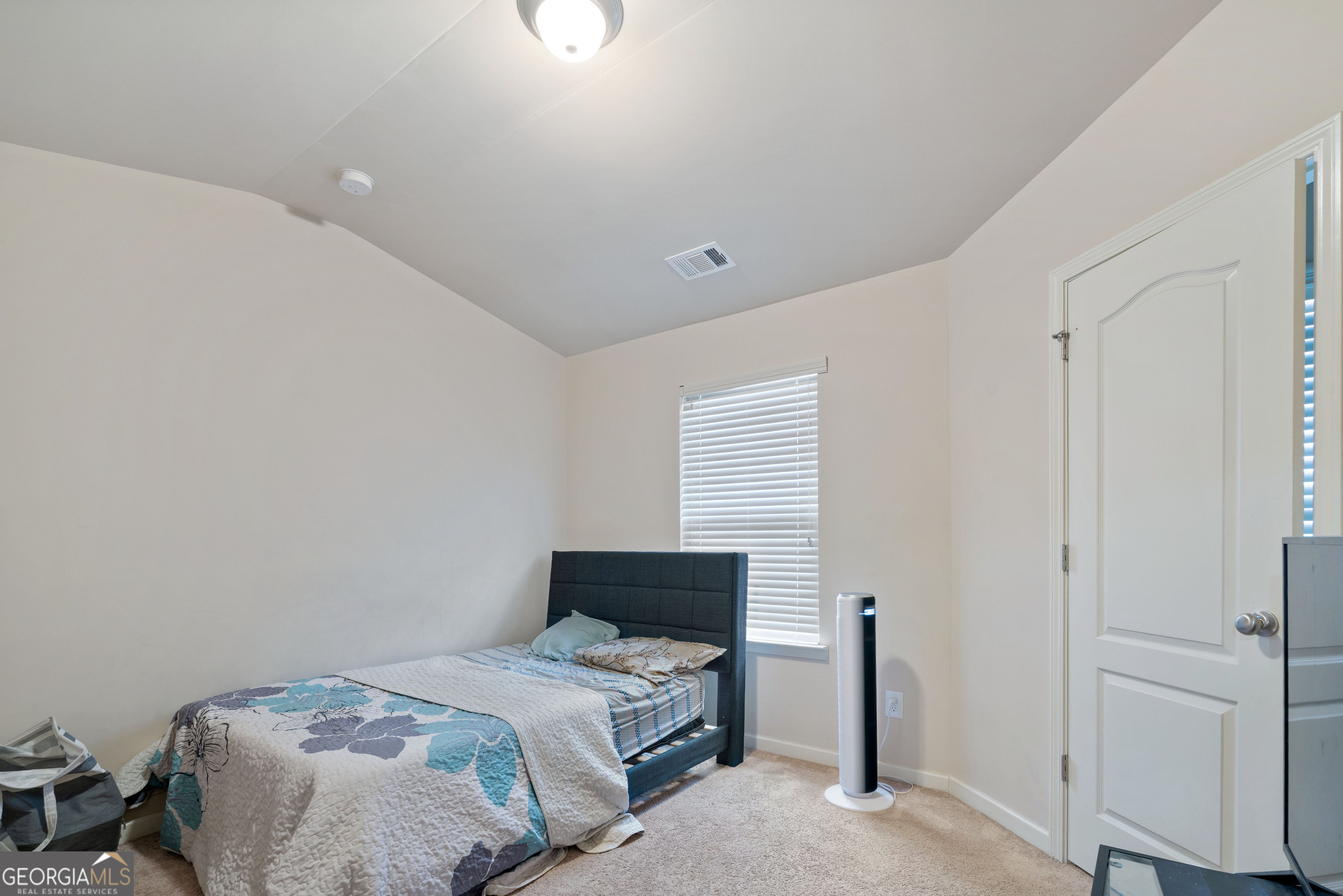 3487 Desoto Road Snellville, GA 30078 - Photo 11 of 13 a bedroom with a bed and a tv