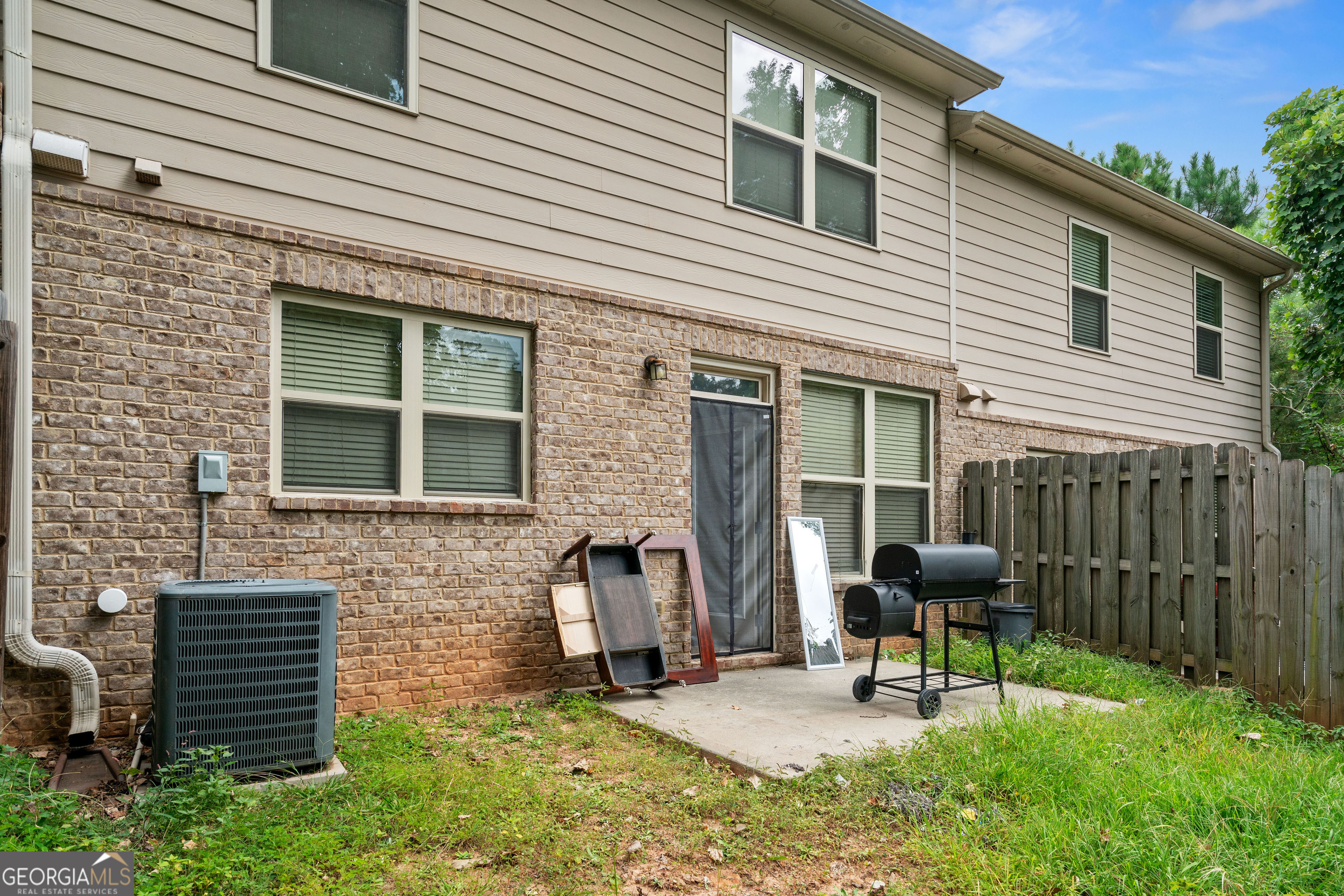 3487 Desoto Road Snellville, GA 30078 - Photo 13 of 13 a backyard of a house with seating space