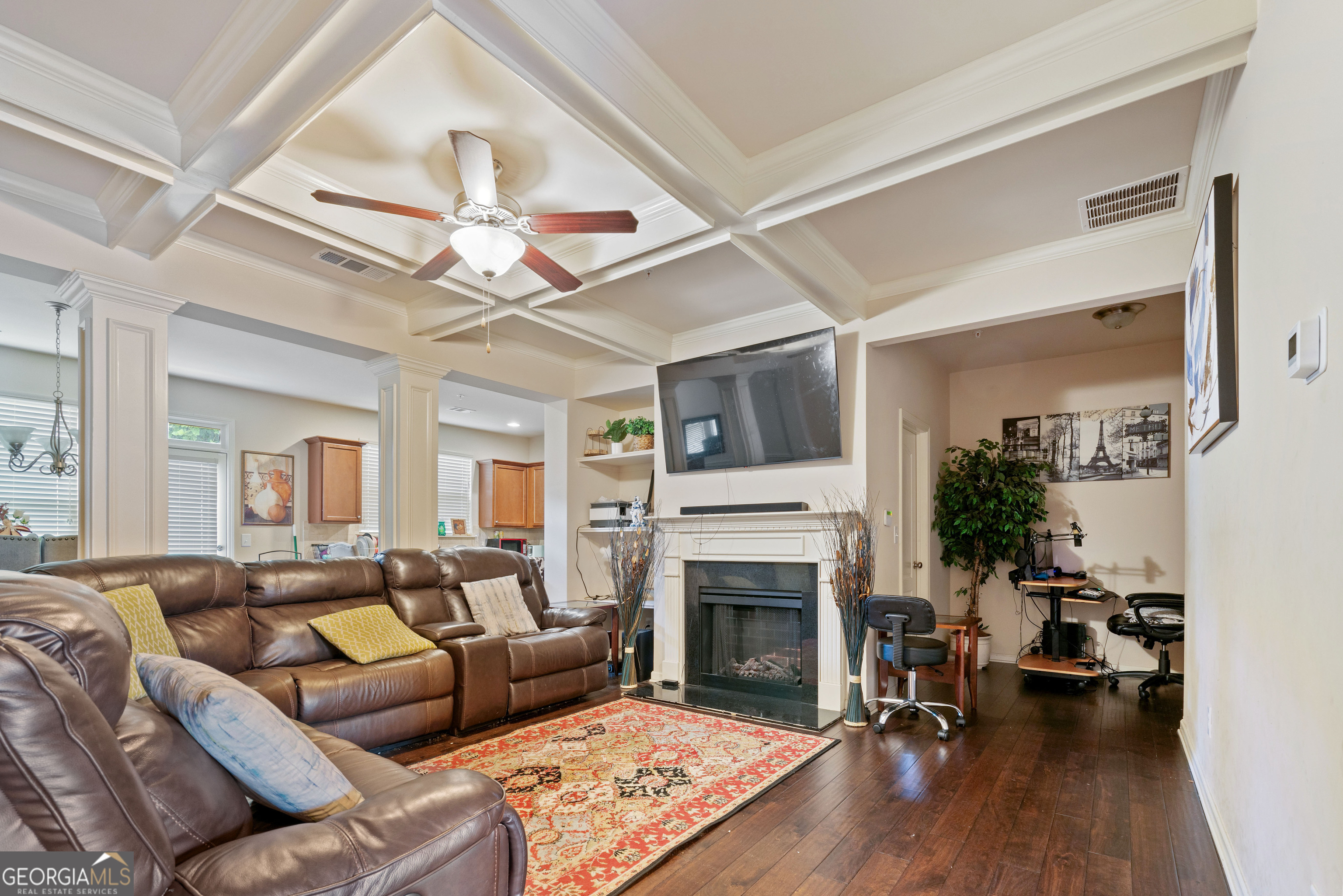 3487 Desoto Road Snellville, GA 30078 - Photo 3 of 13 a living room with furniture a fireplace and a chandelier