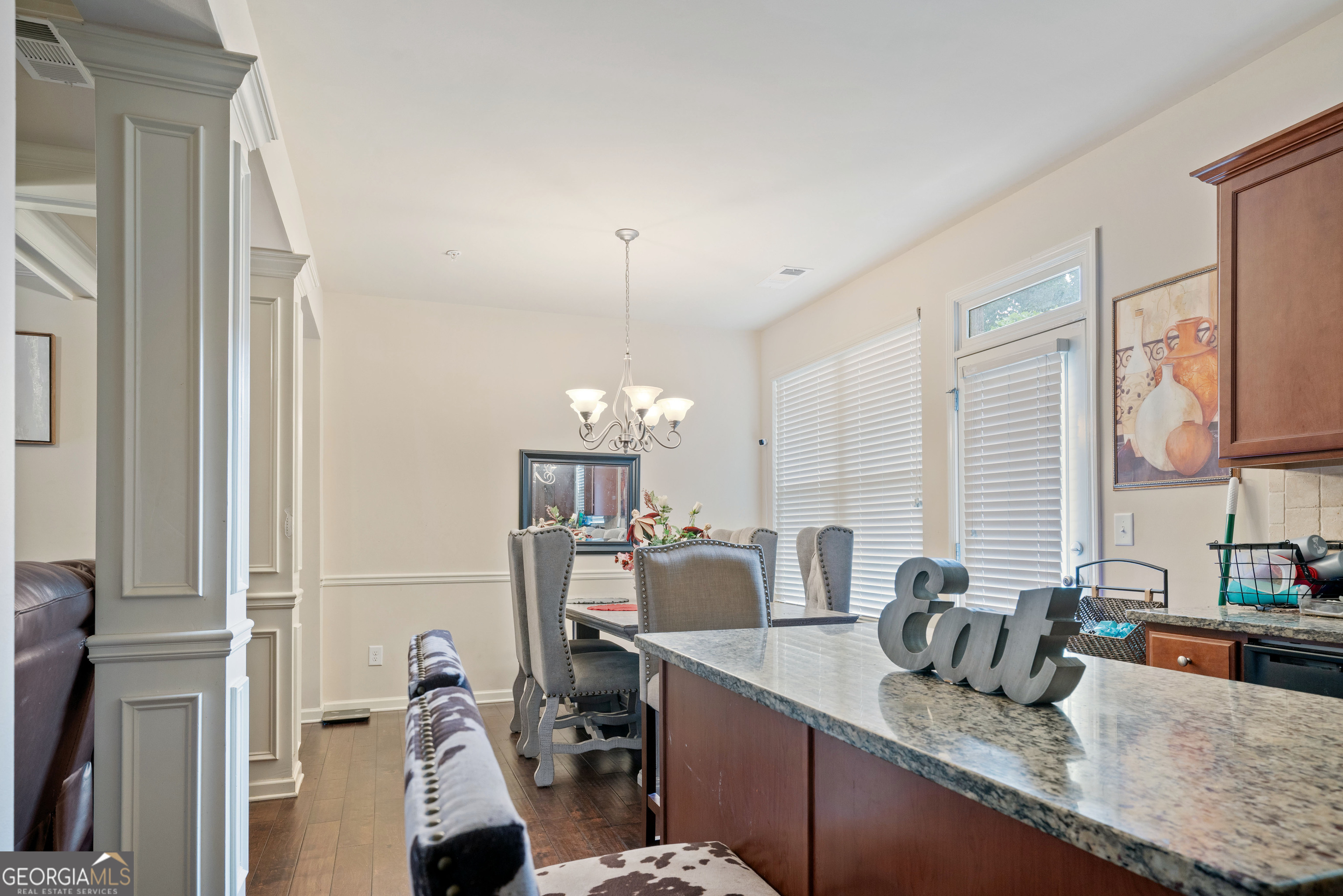 3487 Desoto Road Snellville, GA 30078 - Photo 4 of 13 a kitchen with granite countertop a sink a counter top space appliances and cabinets