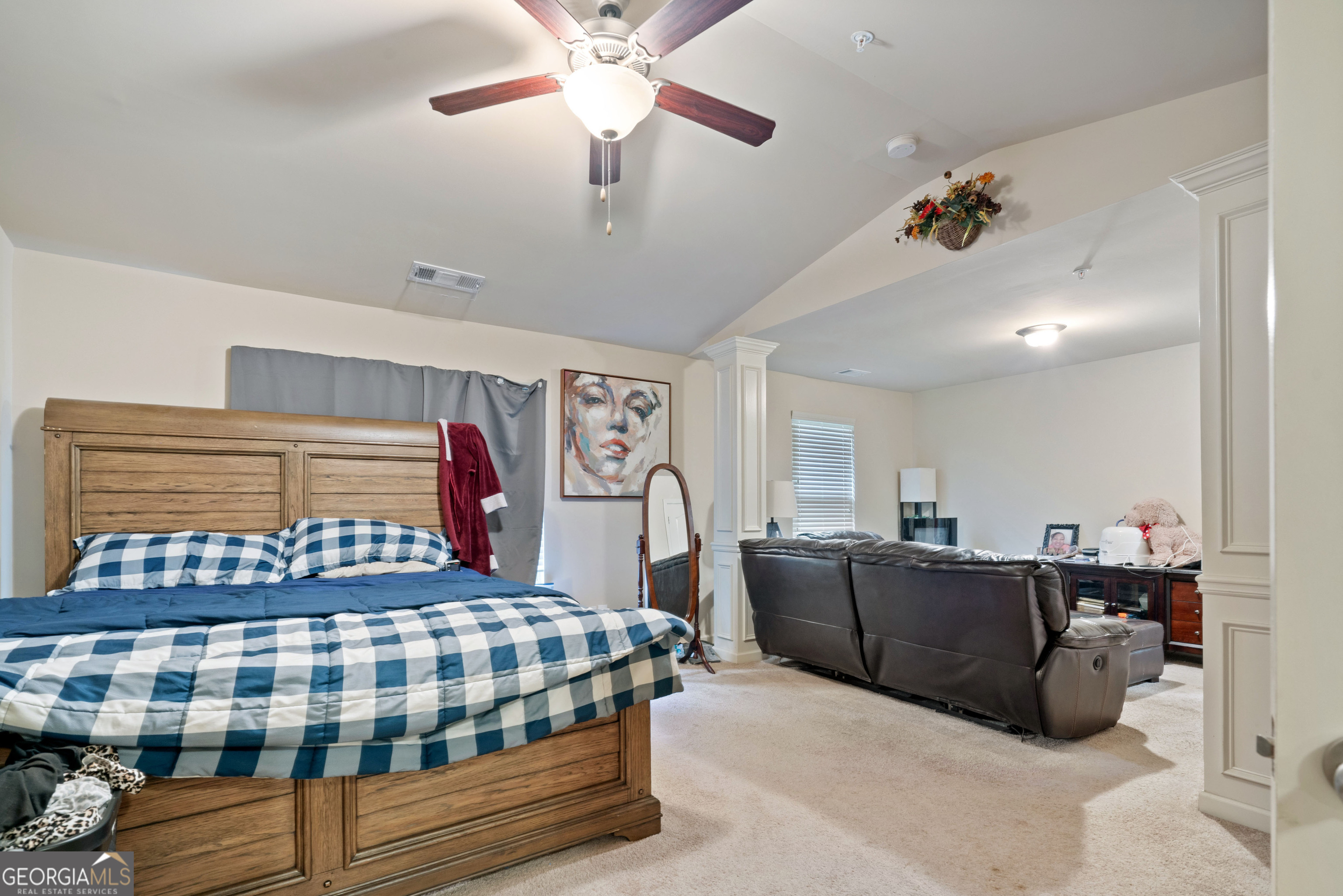 3487 Desoto Road Snellville, GA 30078 - Photo 7 of 13 a bedroom with a bed and ceiling fan