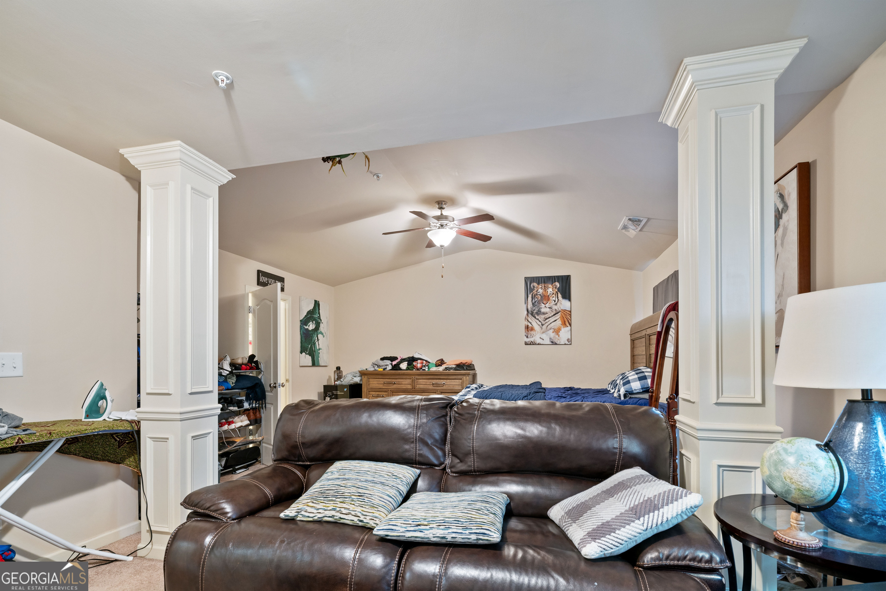 3487 Desoto Road Snellville, GA 30078 - Photo 8 of 13 a living room with furniture and a chandelier