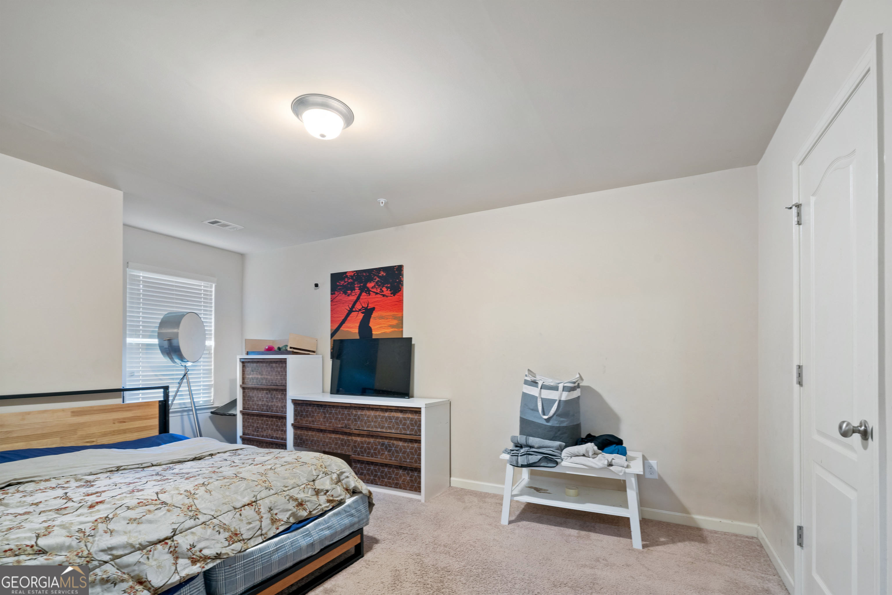 3487 Desoto Road Snellville, GA 30078 - Photo 10 of 13 a bedroom with a bed and a dresser in it