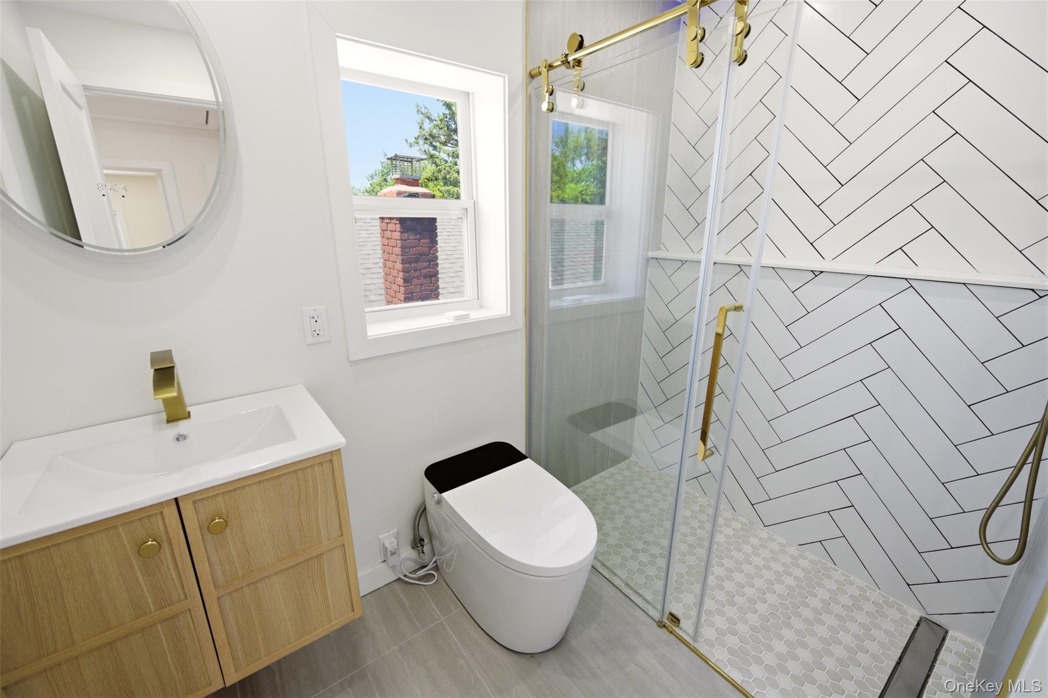 135 Whaley Street Freeport, NY 11520 - Photo 21 of 38 a bathroom with a sink and toilet
