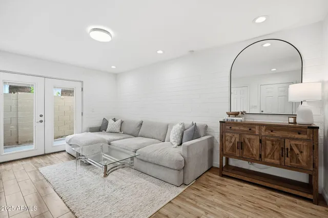 a living room with furniture and a fireplace