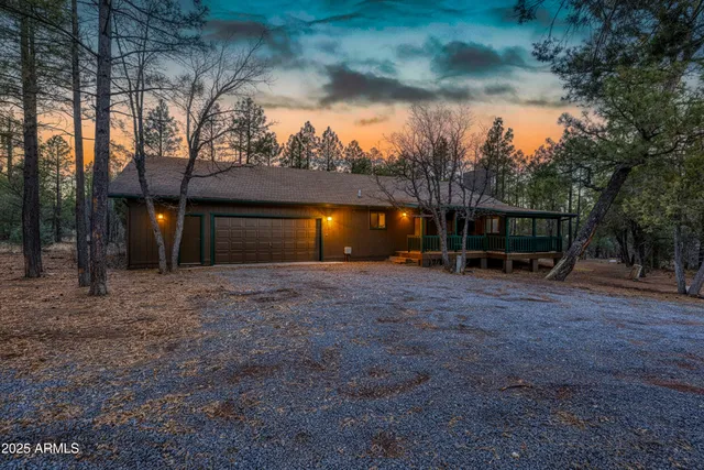 a wooden bench sitting in front of a house