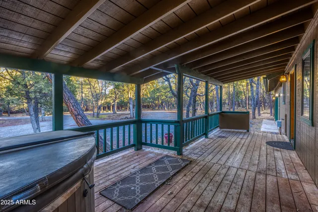 a kitchen with stainless steel appliances granite countertop wooden floors and view living room