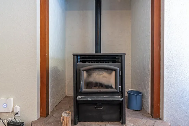 a living room with fireplace furniture and a flat screen tv