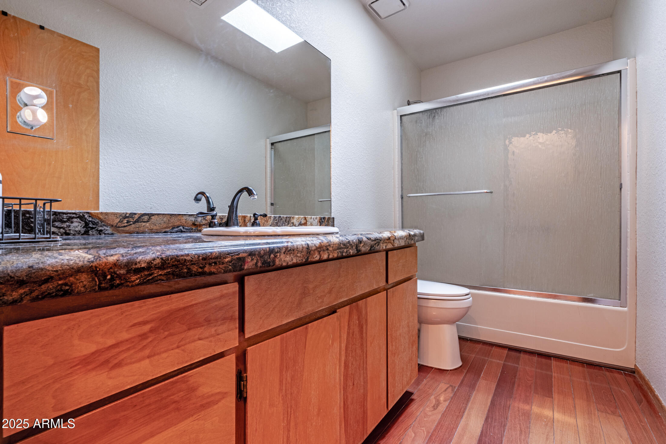 3400 Goodwill Lane Lakeside, AZ 85929 - Photo 28 of 43 a bathroom with a granite countertop sink toilet and shower