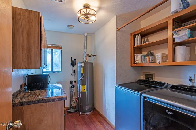 a living room with furniture and a ceiling fan