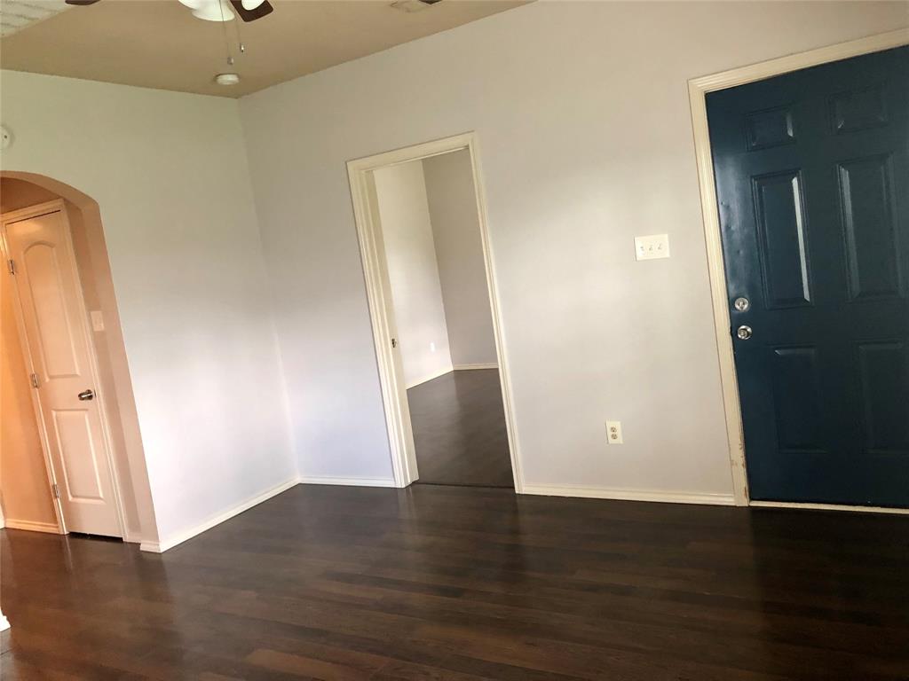 905 Isbell Road Fort Worth, TX 76114 - Photo 3 of 29 Living Room featuring newly installed luxury vinyl plank flooring.