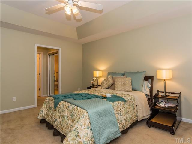 108 Hardaway Point Clayton, NC 27527 - Photo 11 of 21 a bedroom with a bed and a lamp