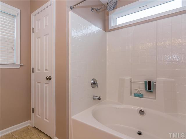 108 Hardaway Point Clayton, NC 27527 - Photo 12 of 21 a bathroom with a bathtub