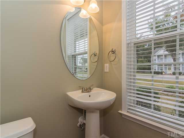 108 Hardaway Point Clayton, NC 27527 - Photo 18 of 21 a bathroom with a sink and a mirror
