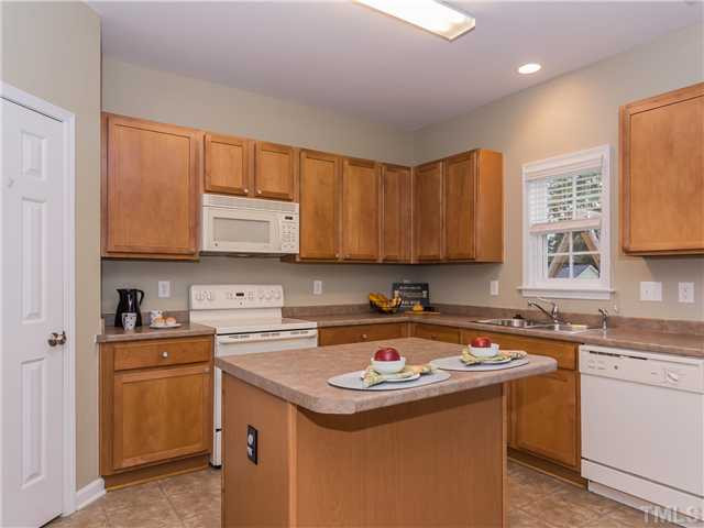108 Hardaway Point Clayton, NC 27527 - Photo 8 of 21 a kitchen with a sink a stove and cabinets
