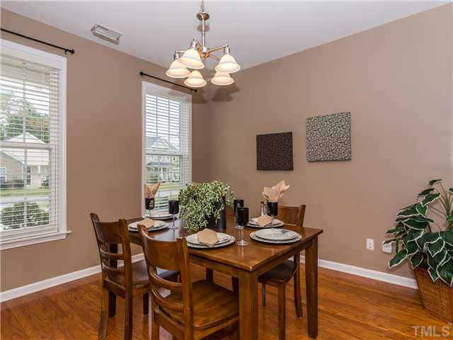 108 Hardaway Point Clayton, NC 27527 - Photo 10 of 21 a view of a dining room with furniture and wooden floor