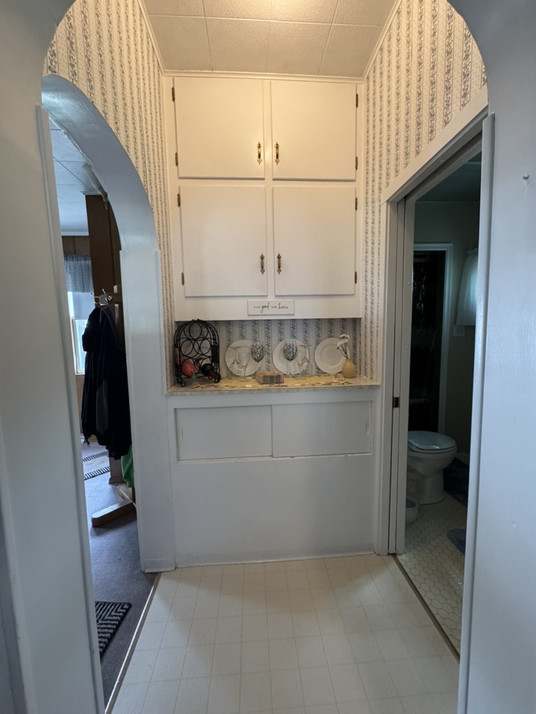 401 West 10th Street Sterling, IL 61081 - Photo 11 of 35 a room with storage and utility