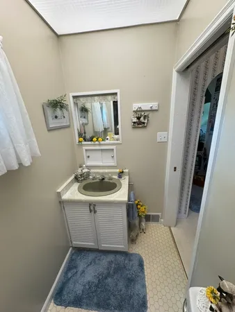 a room with a sink and cabinets